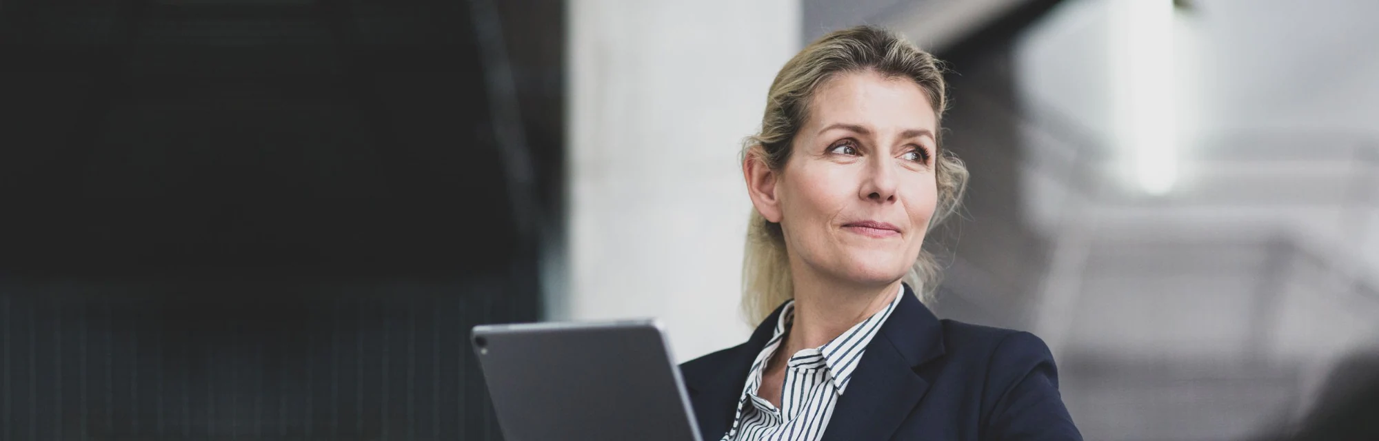 Woman using her tablet to sign on to  New Southampton Online SmartBanking for Business